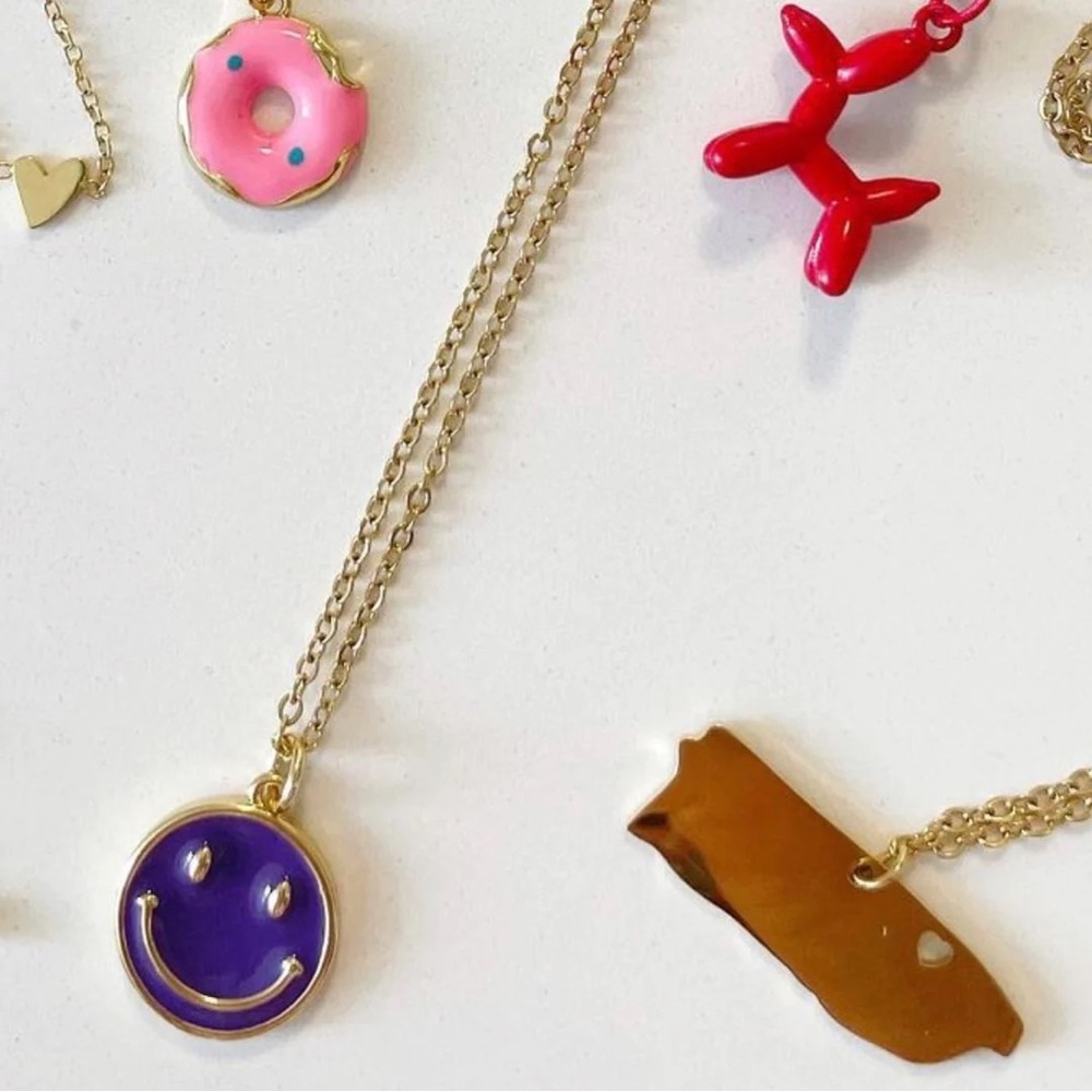 Smiley face necklace purple